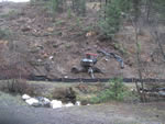 Placing coarse woody debris to prevent run-off on reclaimed guard.